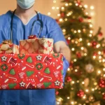 doctor with christmas gifts box edited