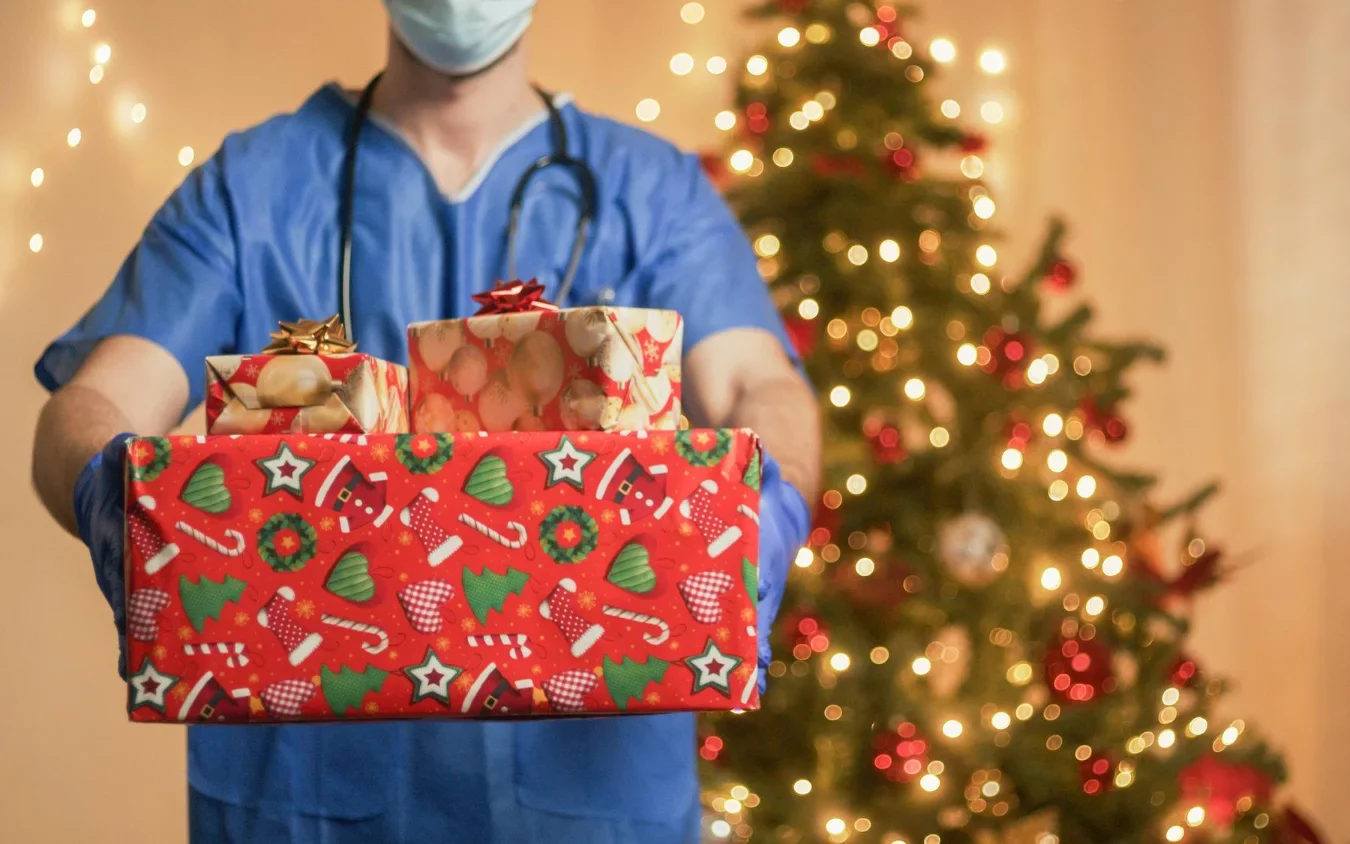 doctor with christmas gifts box edited